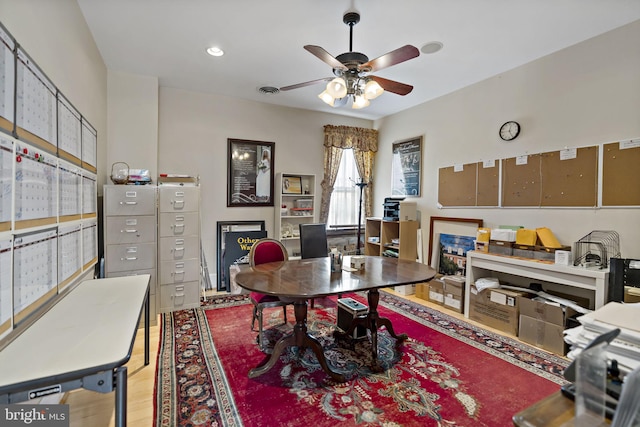 office space featuring ceiling fan and hardwood / wood-style flooring