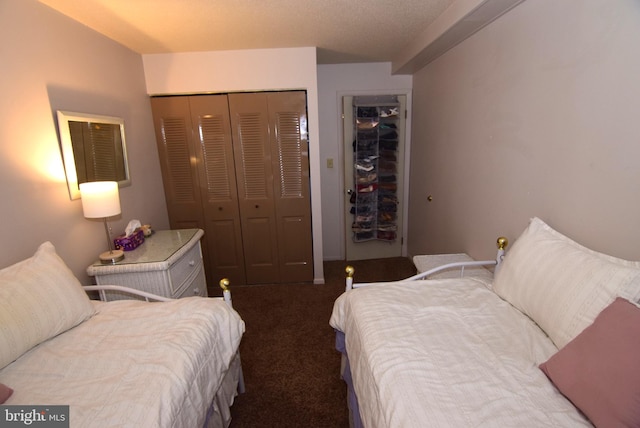 bedroom with a closet and carpet floors