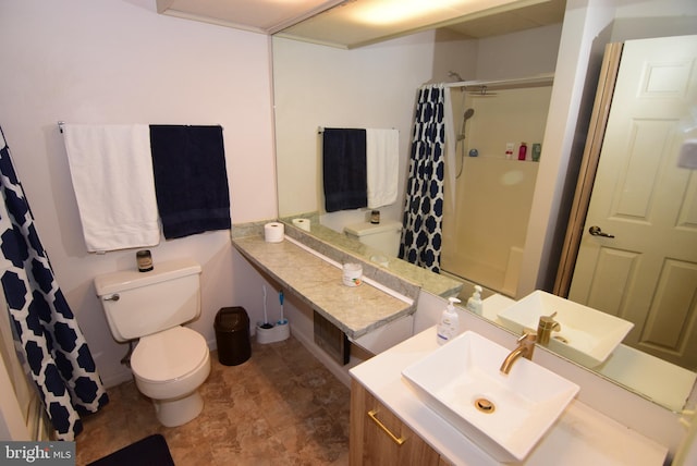 bathroom featuring vanity, toilet, and a shower with shower curtain