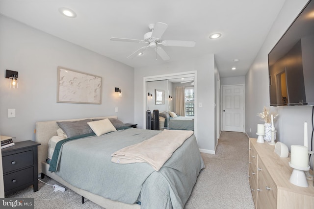 bedroom featuring ceiling fan and light colored carpet