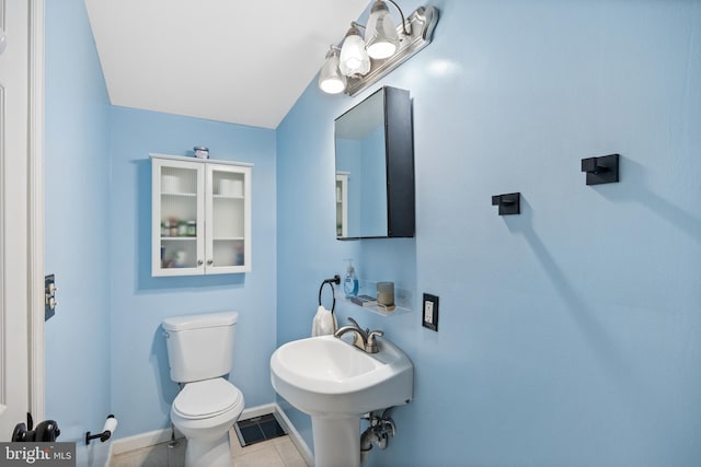 bathroom featuring toilet and tile patterned floors