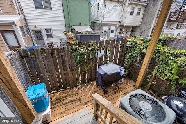 wooden deck featuring area for grilling