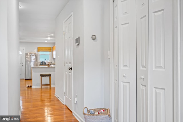 corridor featuring light hardwood / wood-style flooring