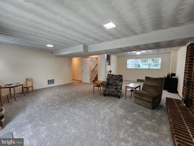 living area featuring carpet