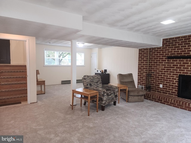 living area featuring light carpet, a brick fireplace, and a baseboard radiator