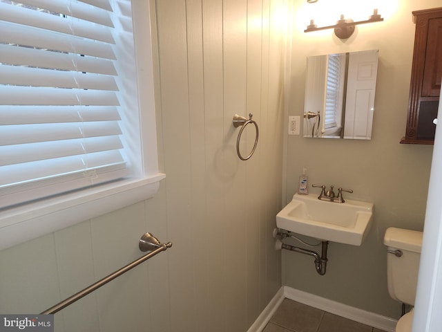 bathroom featuring sink, tile patterned floors, and toilet