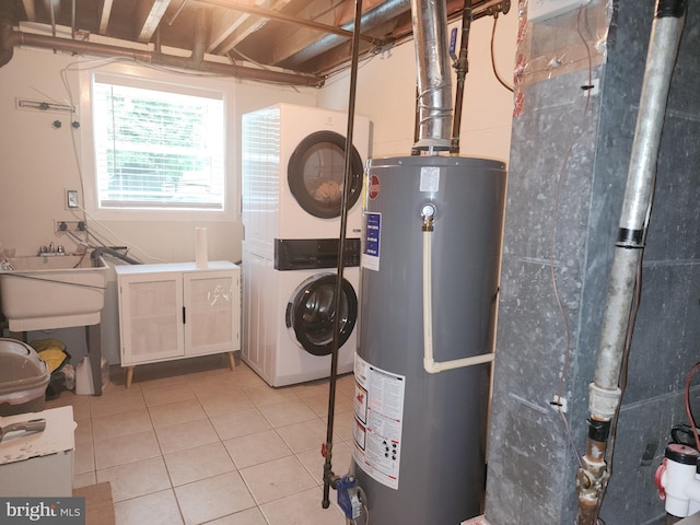 utility room with water heater, stacked washing maching and dryer, and sink