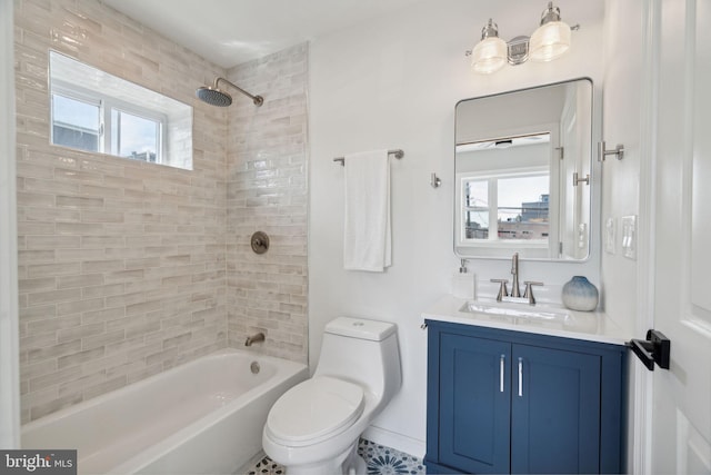 full bathroom with vanity, toilet, and tiled shower / bath