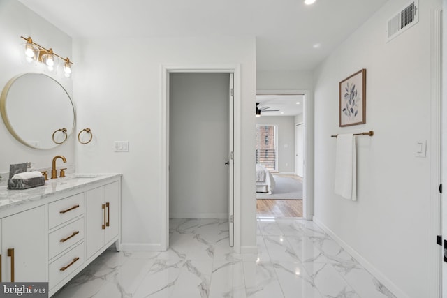 bathroom featuring ceiling fan and vanity