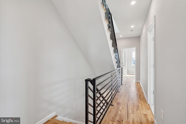 corridor with light wood-type flooring