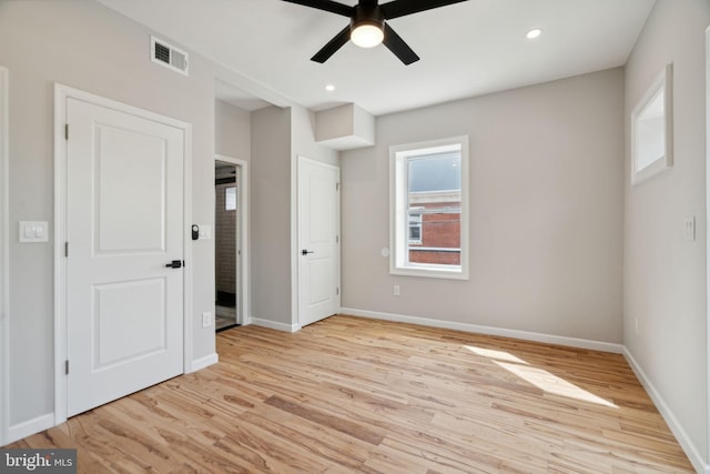 unfurnished bedroom featuring ceiling fan and light wood-type flooring