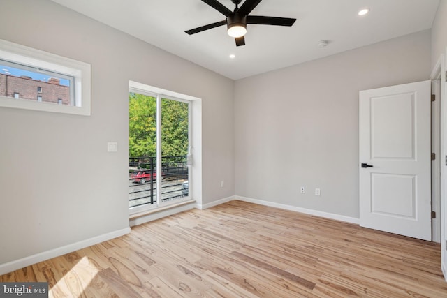 spare room with ceiling fan and light hardwood / wood-style flooring