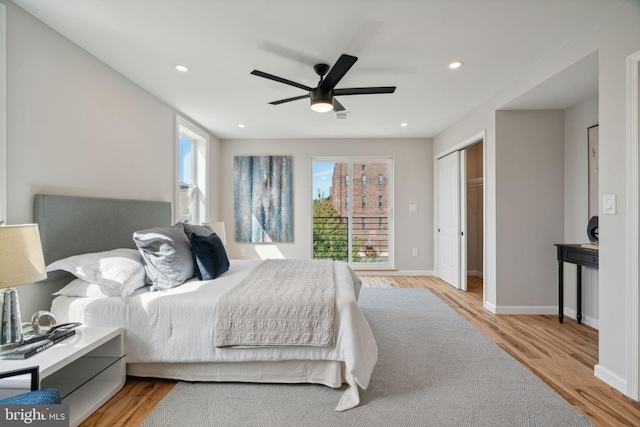 bedroom featuring ceiling fan and light hardwood / wood-style floors