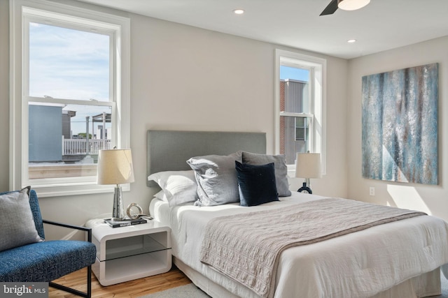 bedroom with light wood-type flooring and ceiling fan