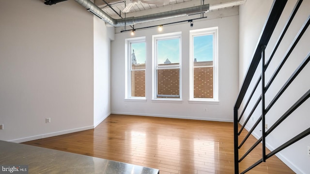 spare room with hardwood / wood-style flooring