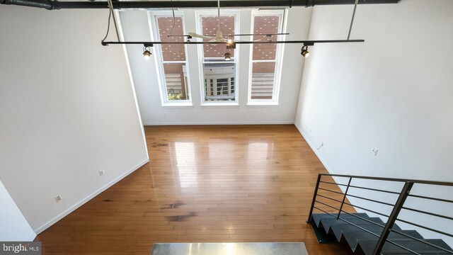 unfurnished living room with wood-type flooring