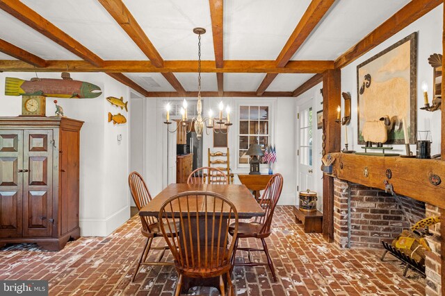 dining room with beam ceiling and a notable chandelier