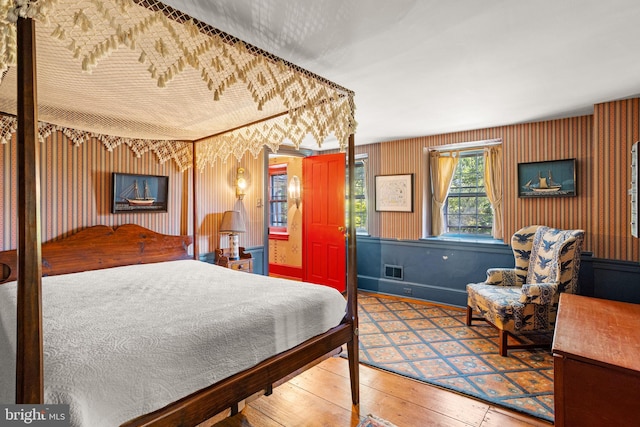 bedroom with hardwood / wood-style floors