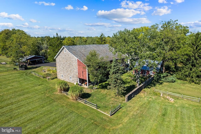 birds eye view of property with a rural view