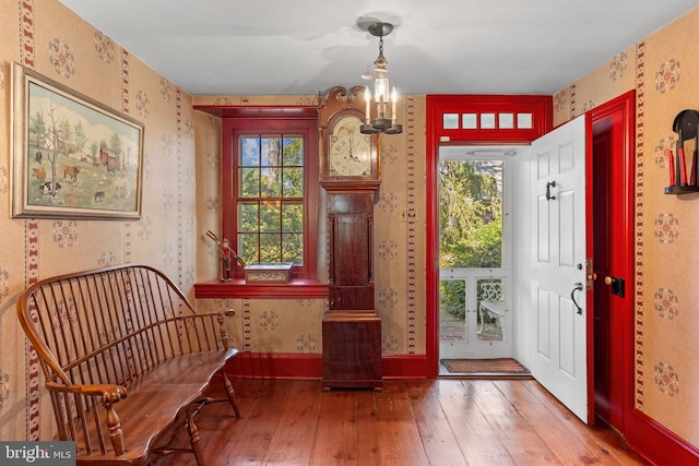 entrance foyer featuring a notable chandelier and hardwood / wood-style flooring