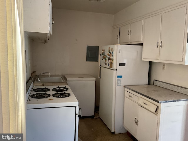 kitchen with electric panel, sink, white appliances, and white cabinetry