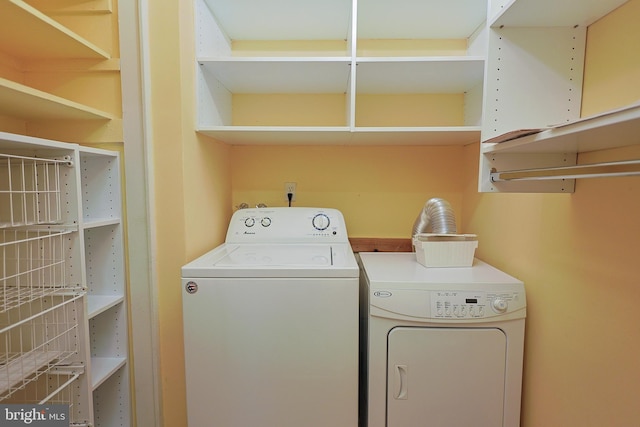 clothes washing area featuring washing machine and dryer