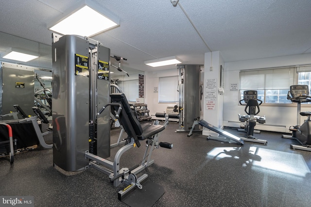 workout area with a textured ceiling