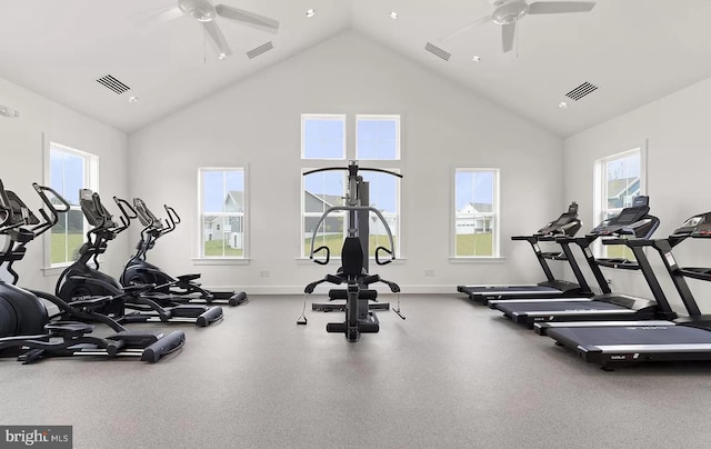 gym with ceiling fan and high vaulted ceiling