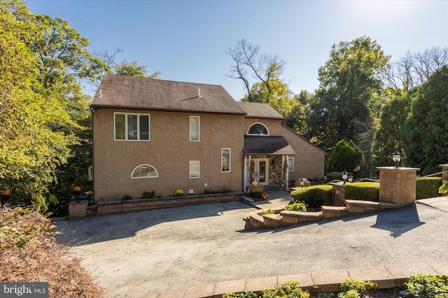 back of house with a patio area