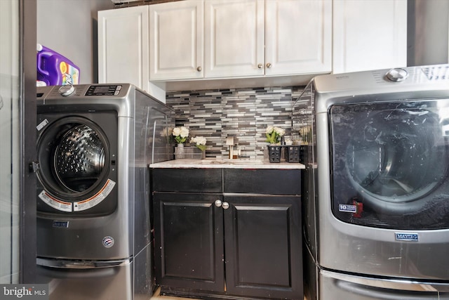 washroom with sink and cabinets