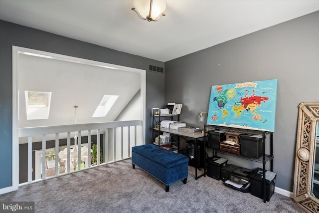 office area featuring lofted ceiling with skylight and carpet floors