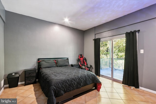 tiled bedroom featuring access to exterior