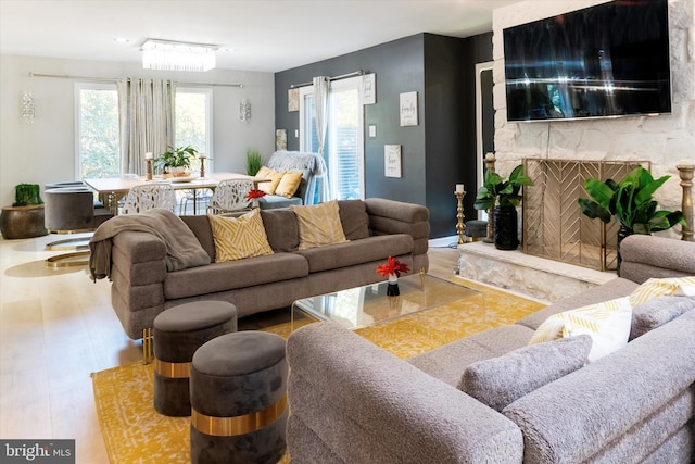 living room featuring hardwood / wood-style flooring and a fireplace