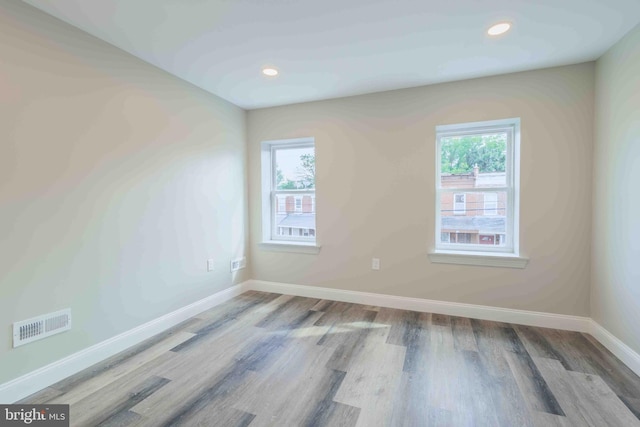 empty room with wood-type flooring