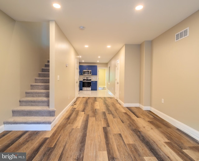 hallway featuring dark hardwood / wood-style floors