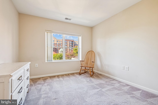 unfurnished room featuring light colored carpet