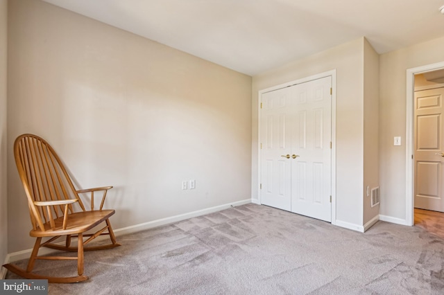 unfurnished room with light colored carpet