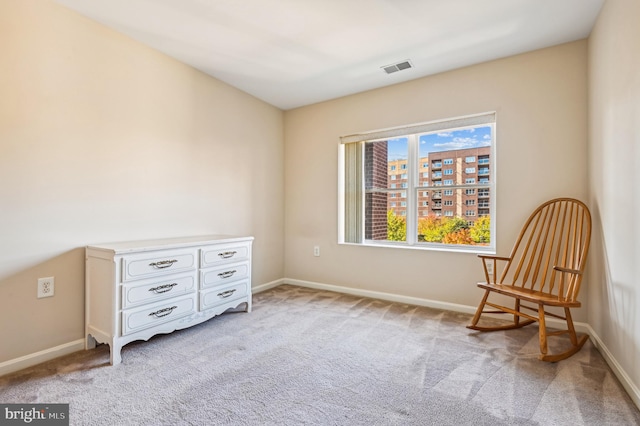 sitting room with light colored carpet