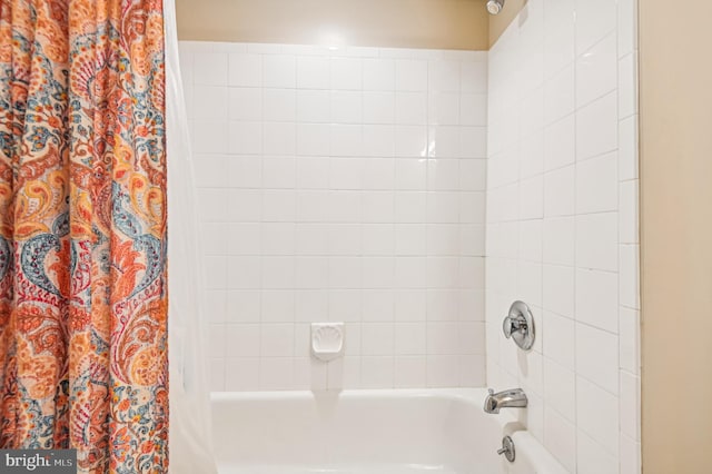 bathroom with shower / tub combo with curtain