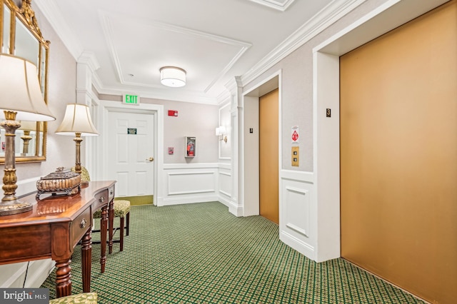 hall featuring carpet floors, ornamental molding, and elevator