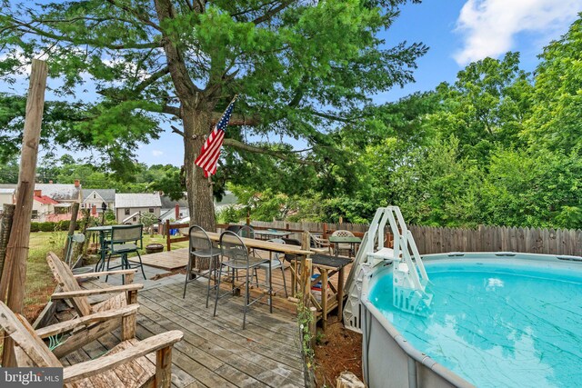 view of pool featuring a wooden deck