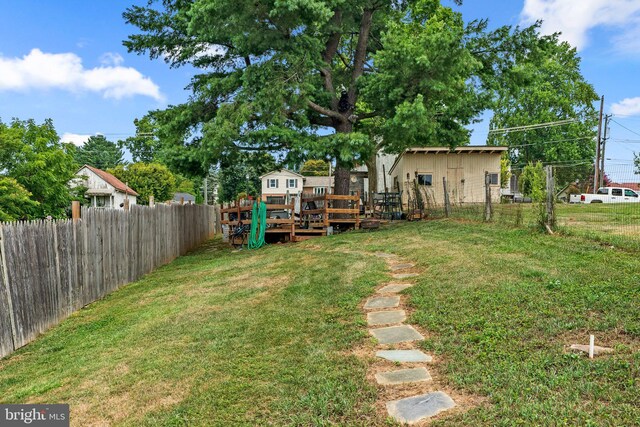 view of yard featuring a wooden deck