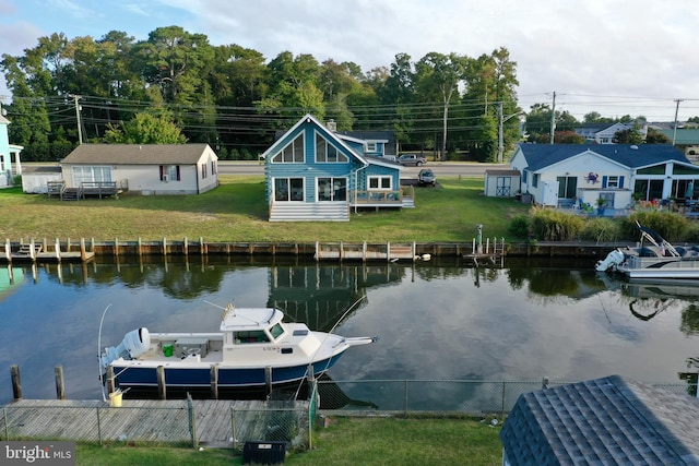 dock area featuring a water view and a yard