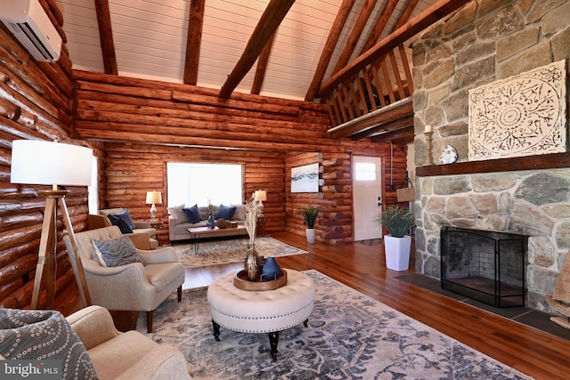 unfurnished living room with a wall unit AC, wood-type flooring, rustic walls, high vaulted ceiling, and a fireplace