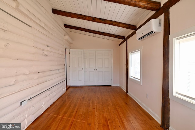 hallway with wooden ceiling, light hardwood / wood-style floors, a wall mounted AC, and vaulted ceiling with beams