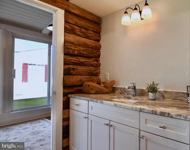 bathroom with vanity and rustic walls