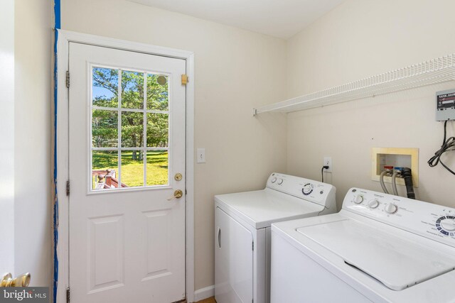 washroom with washer and dryer