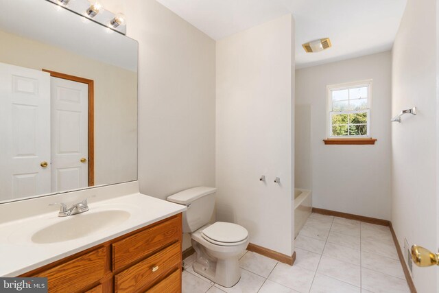 full bathroom featuring independent shower and bath, vanity, toilet, and tile patterned floors