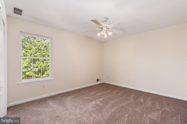 carpeted empty room with ceiling fan