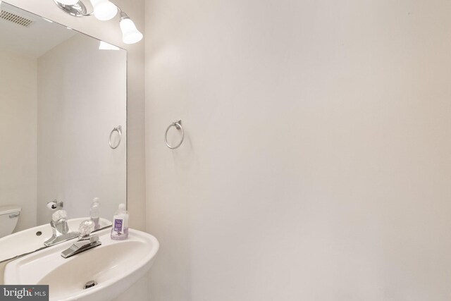 bathroom with sink and toilet